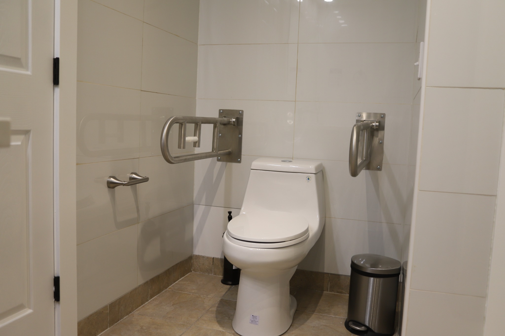 Accessible toilet area with grab bars